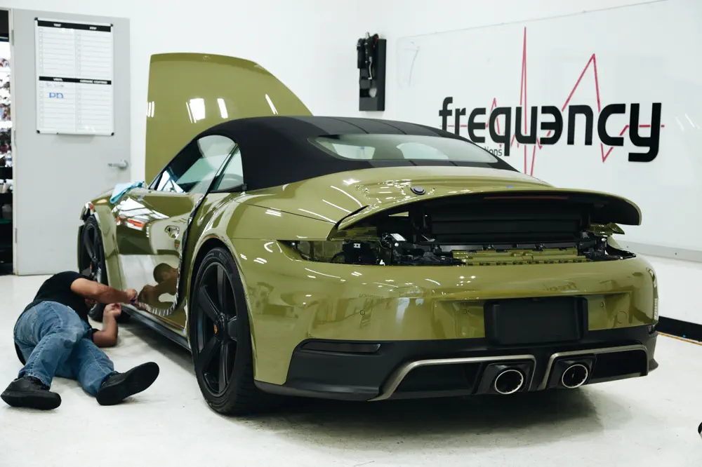 Green Porsche 911 Targa with fresh paint protection film at FRQNCY Woods Cross