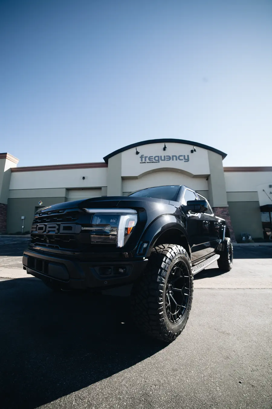 Blacked-out Ford Raptor outside the Frequency shop in Woods Cross UT