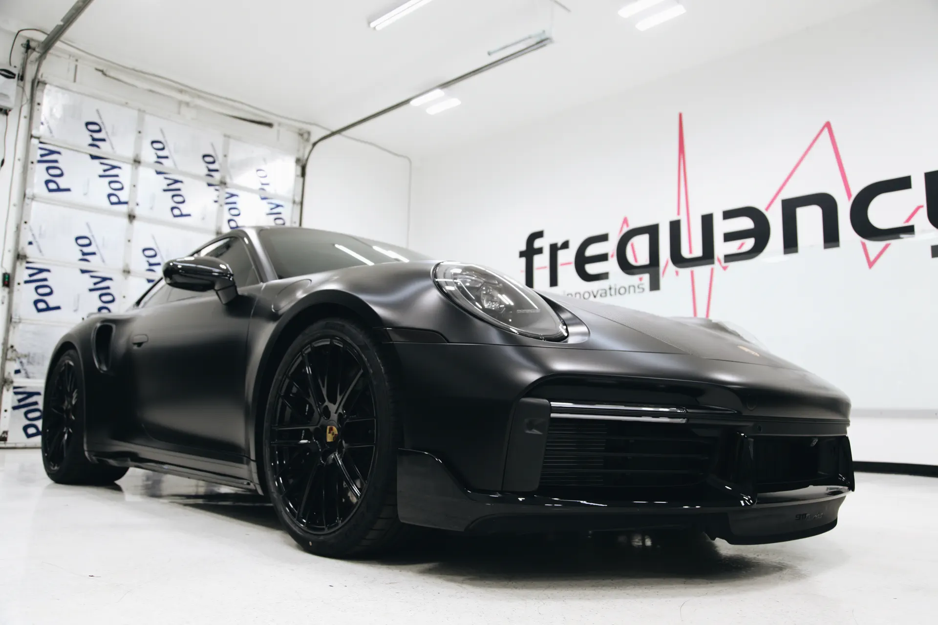Matte black Porsche 911 with full paint protection film in the FRQNCY studio, Woods Cross UT